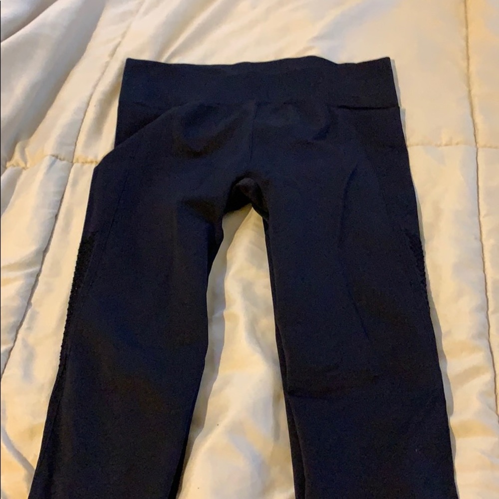 Black leggings with leg detail.